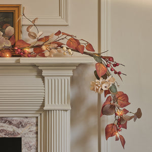Pre-lit autumn foliage garland with berries and warm white lights