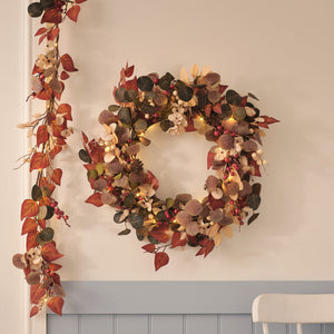 Pre-lit berry harvest wreath and autumn foliage garland with warm white lights
