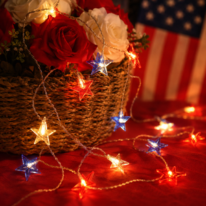 red white and blue 4th of july star string lights hanging on porch patio and garden party space