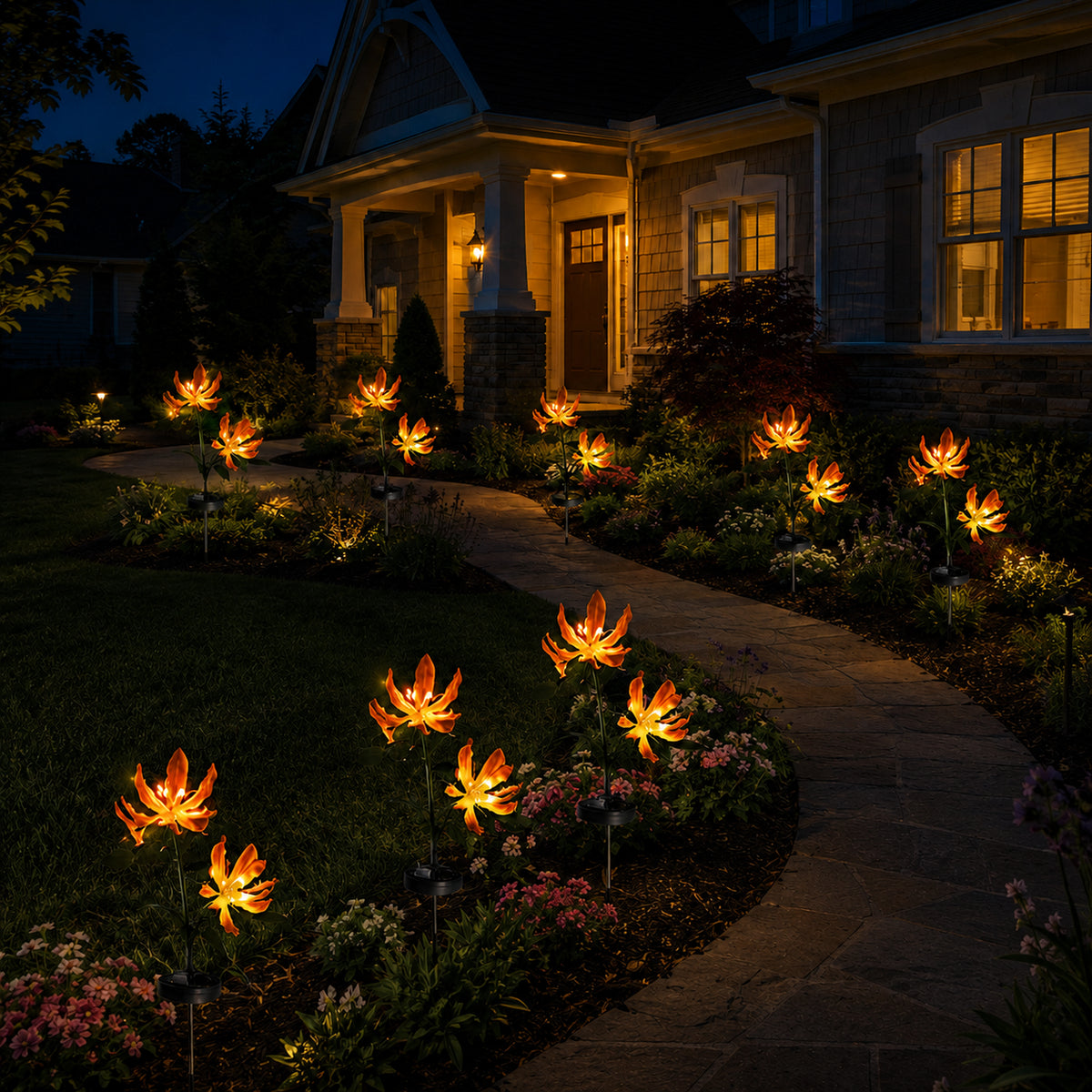 Solar fire lily lights following the curve of a garden walkway at night