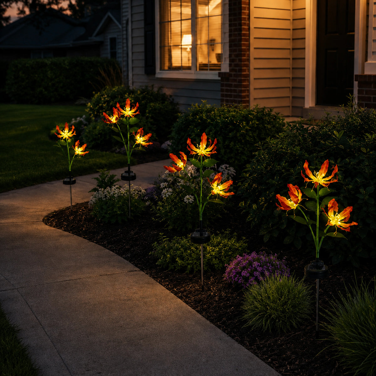 Solar fire lily garden lights welcoming guests along a front entry