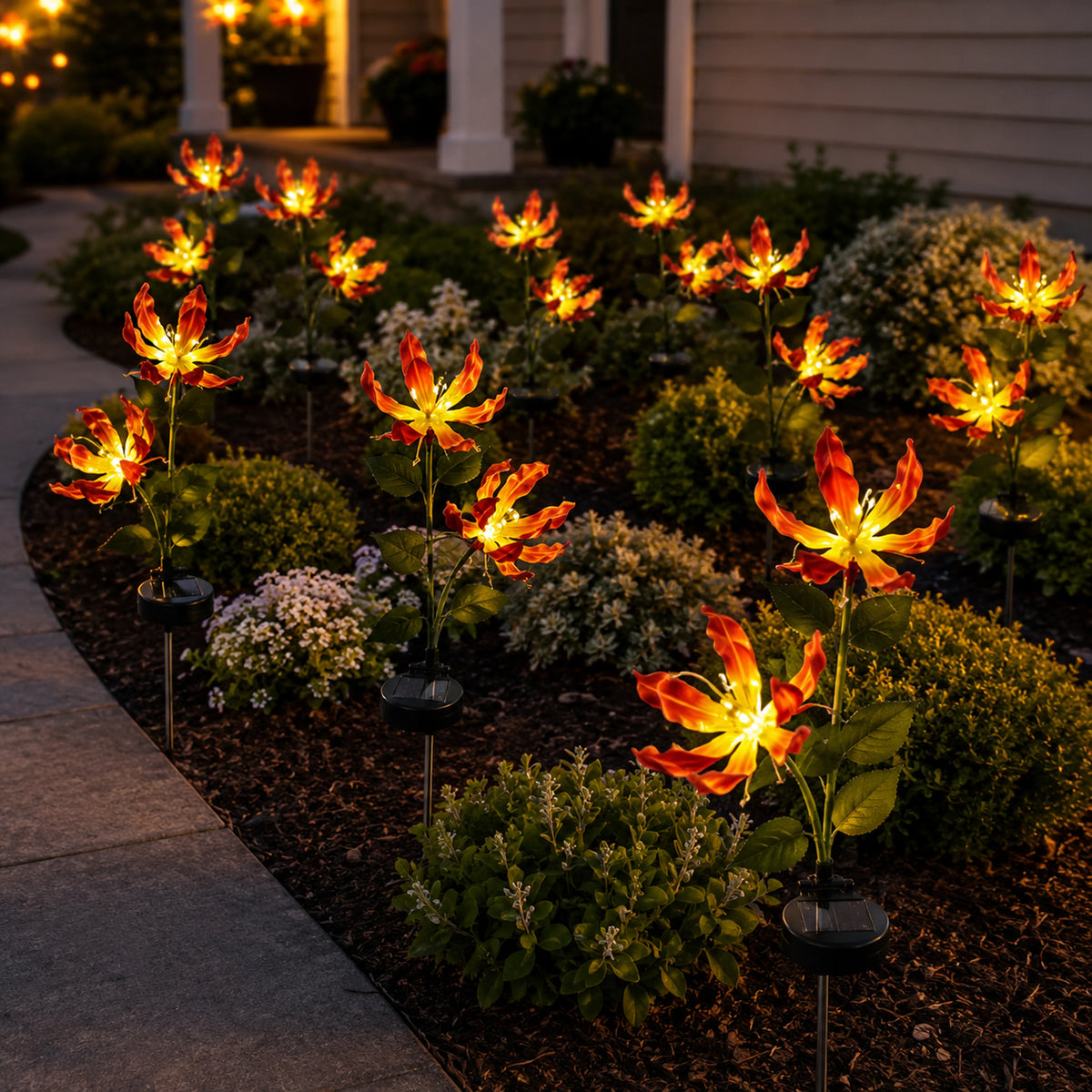 Solar fire lily lights guiding a front pathway at night