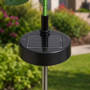 Close view of the solar panel base on a flame lily garden stake light