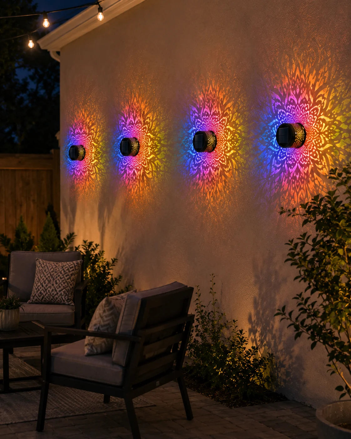 Colorful mandala lights on a patio wall